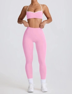 Detailed view of pink yoga set with halter sports bra and high waist seamless leggings