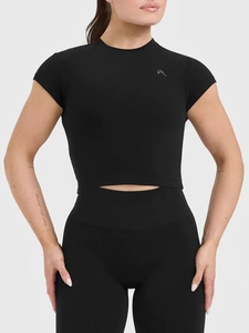 Slim fit black yoga crop top and high waist leggings set with athletic silver logo