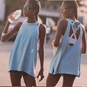Detail of light blue yoga top featuring a stylish back cutout and ribbon tie design