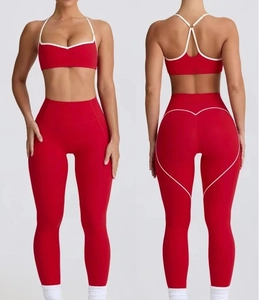 Detail view of red yoga set with white heart contour stitching for booty lifting effect