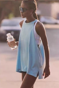 Close-up of light blue yoga top featuring a side slit and loose fit for athletic wear