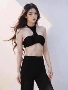 Detail of black halter yoga bra with cut-out design and removable padding fabric