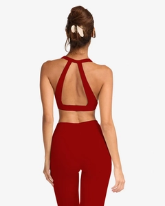 Detailed back view of red yoga set with water drop hollow design and padded sports bra