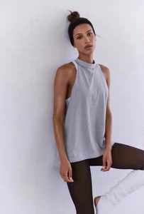 Detail of the open back yoga top with stylish side cutout showing athletic layers