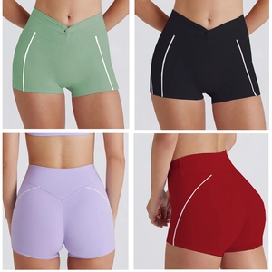 Detail of high-waisted yoga shorts with V-cross waistband and white contrast piping accents