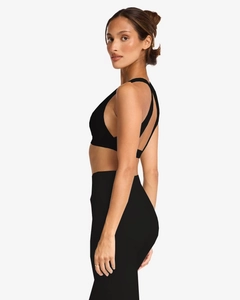 Side view of black yoga set featuring racerback sports bra and high-waisted shorts