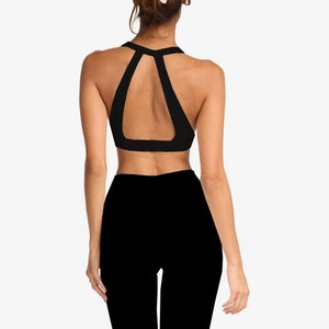 Detail view of the black yoga sports bra featuring a unique triangular open back cutout design
