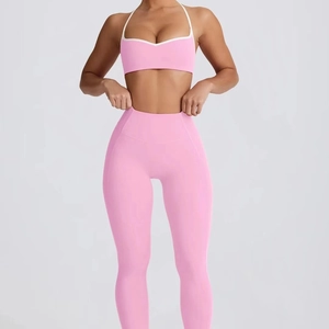 Pink high-stretch heart-shaped yoga set with cross-strap bra and high-waist peach leggings