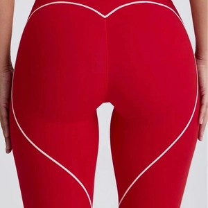 Women's high-waist red yoga leggings with heart-shaped back stitching for butt-lifting effect