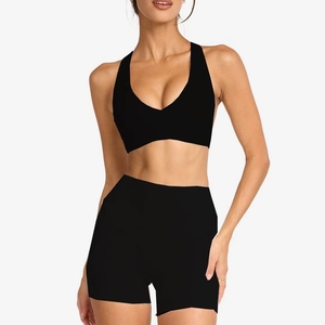 Women's black 2-piece yoga set with V-neck sports bra and high-waist biker shorts