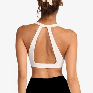 White yoga sports bra with back triangle cutout design and halter neck detail