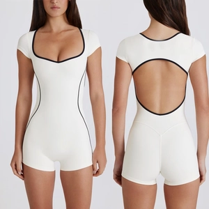 Short sleeve backless yoga romper in white with black contrast trim front and back view