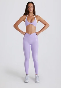 Detailed view of light purple yoga set with halter neck top and high-waist leggings