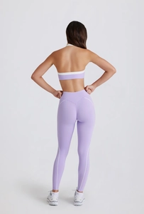 Back view of a lilac yoga set with a halter sports bra and high-waisted leggings