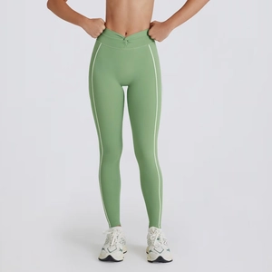 Sage green high-waisted yoga leggings with twist knot detail and side white stripes