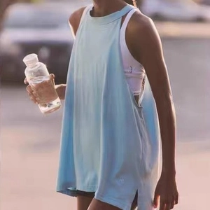 Light blue loose yoga tank top with open sides and crew neck for workout and running