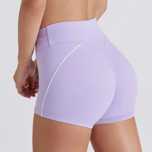 Close-up of lilac high-waisted yoga shorts with white curved lifting seam details