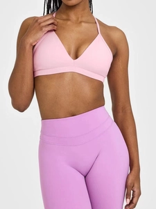 Set aus rosa Sport-BH mit V-Ausschnitt und lila High-Waist Yoga-Leggings für Fitness
