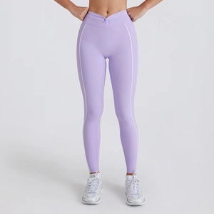 Close-up of purple yoga leggings featuring a high waist cross knot and white side stripes