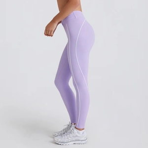 Detail view of lavender yoga leggings featuring white wavy contrast stitching and high waist