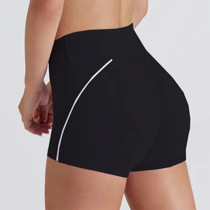 Detail view of high-waist black gym shorts with purple side stripes and compression fit