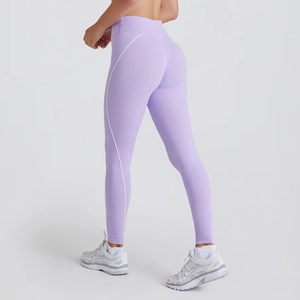 Detail of high-waist lavender yoga leggings with white contrast seams and compression band