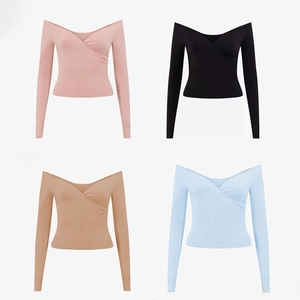 Detail of V-neck cross-wrap yoga tops featuring off-shoulder design and ribbed texture