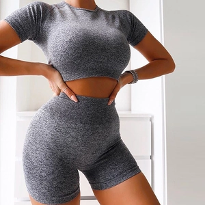 Detailed knit texture of grey seamless high waist yoga shorts and matching crop top set