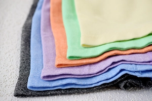Close-up of ribbed texture and elastic waistband on seamless yoga shorts in various colors