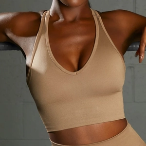 Women's seamless V-neck yoga sports bra in light brown with ribbed supportive waistband