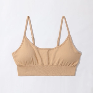 Detail of nude seamless sports bra with adjustable straps and ribbed wide hem