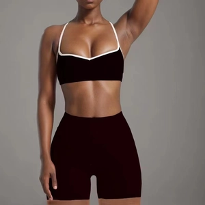 Two-piece black yoga set with high-elastic sports bra and tight peach-butt gym shorts