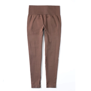Detail of coffee brown high-waisted ribbed yoga pants with seamless knitted texture