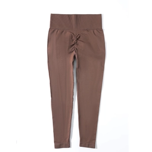 Detail of high waisted scrunch butt yoga leggings in deep chocolate brown seamless fabric