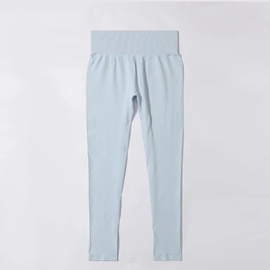 Detail view of light blue high-waisted ribbed yoga leggings with seamless elastic fabric