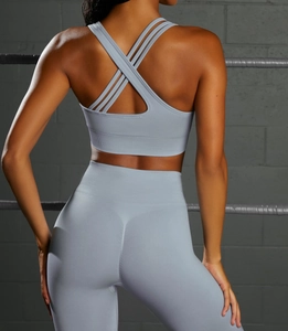 Detail of light blue seamless yoga set with cross-back sports bra and ribbed texture