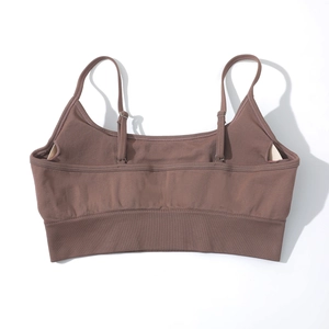 Front view of brown yoga sports bra with thin adjustable straps and ribbed hem detail