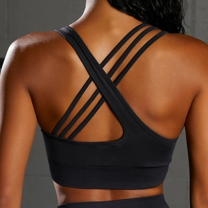 Close-up of seamless cross-back sports bra with geometric straps and ribbed hem support
