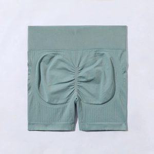 Détail du short de yoga sans couture à taille haute avec effet push-up en vert sauge