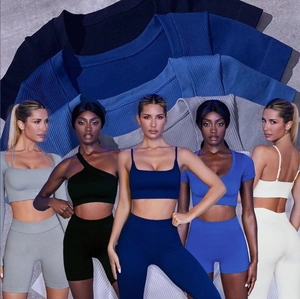 Seamless ribbed yoga set for women featuring sports bra and high waist biker shorts