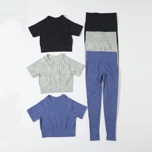 Seamless yoga set featuring high waist leggings and crop top with wave pattern textures