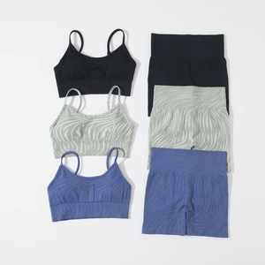 Seamless knitted yoga set with strappy sports bra and high-waisted shorts in three colors