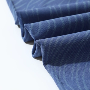 Close-up of blue wave pattern seamless knit yoga fabric with breathable micro-pores