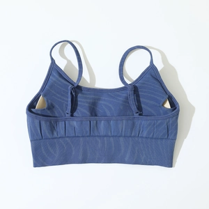 Detail of dark blue seamless yoga sports bra with adjustable straps and ribbed band