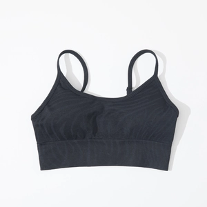 Detail of black seamless sports bra with thin straps and ribbed band support