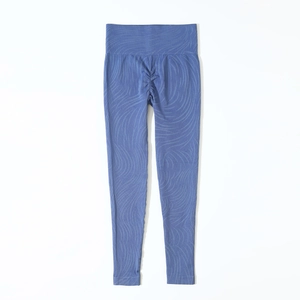 Detail of dark blue high-waisted seamless leggings with wave texture and scrunch butt effect
