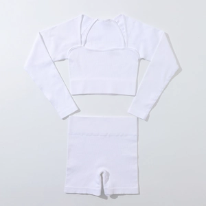 Detailed macro view of the seamless ribbed knit texture on white yoga set for women