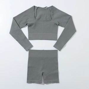 Close-up of ribbed texture on seamless grey yoga set with long sleeve top and high waist shorts