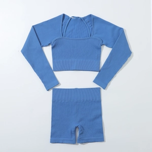 Detail of light blue ribbed seamless yoga set showing crop top and high waist shorts