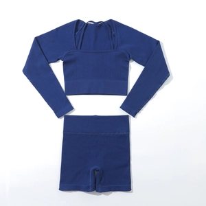 Flat lay of seamless ribbed yoga set featuring square neck crop top and high waist shorts